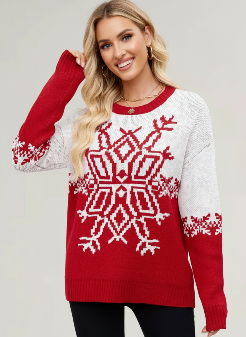 Woman wearing a red and white patterned sweater on a plain background