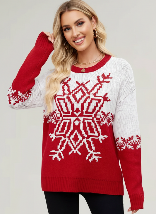 Woman wearing a red and white patterned sweater on a plain background